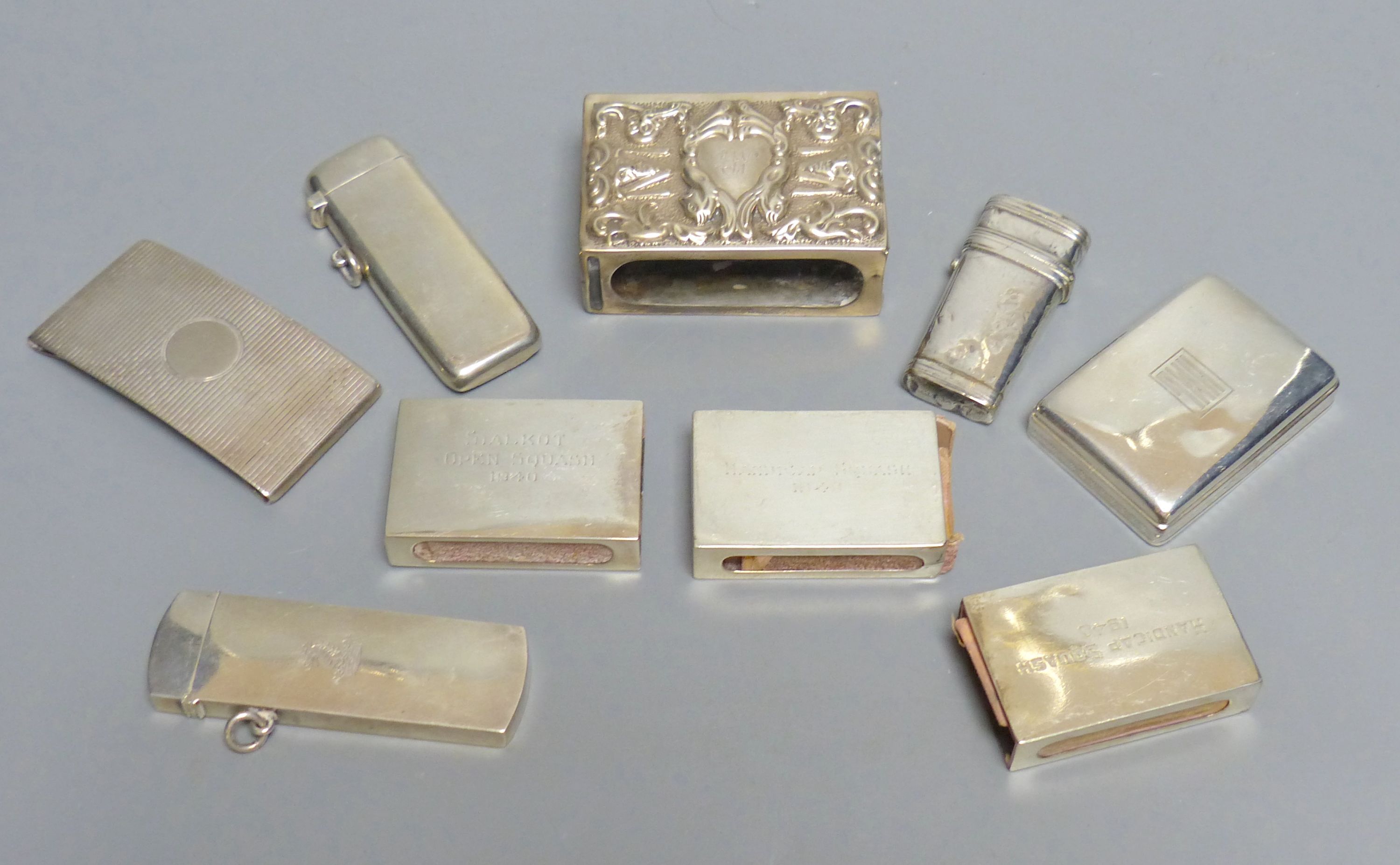 Two late Victorian silver diary cases, largest 85mm and seven other items including silver match sleeves & a silver fleam case.